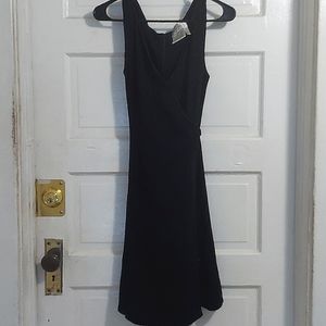 Badgley Miscka black cocktail dress. Beautifully sequened lined neckline.